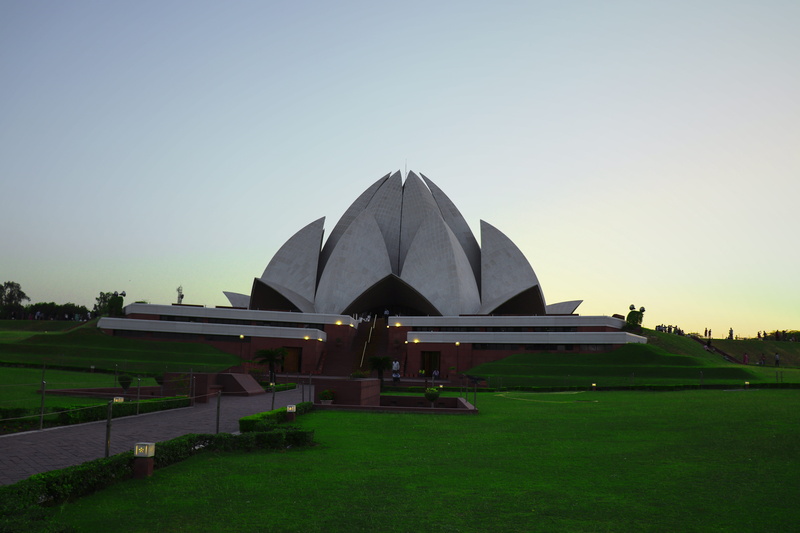 lotus temple, travel destinations, day, landmark, architecture, stone, sky, heritage, wall, city, nature, outdoors, lotus, field, green color, building exterior