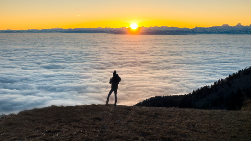 alps, view, sun, lifestyles, alpine, cloud - sky, outlook, fog, land, sea of fog, sky, standing, tranquility, leisure activity, silhouette, rear view, full length