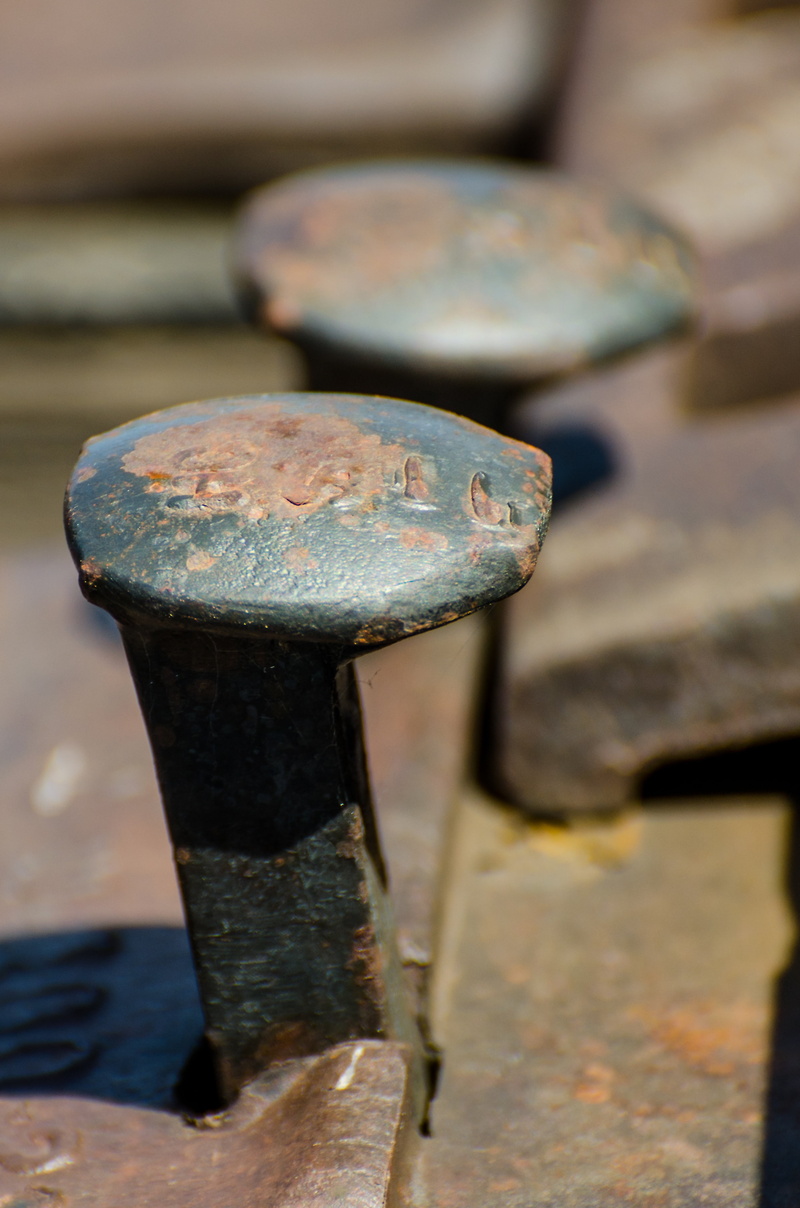 railroad stakes, ties, steel, damaged, nature, hard, train, close-up, obsolete, deterioration, weathered, brown, sunlight, old, rail, stake, rusted, nail