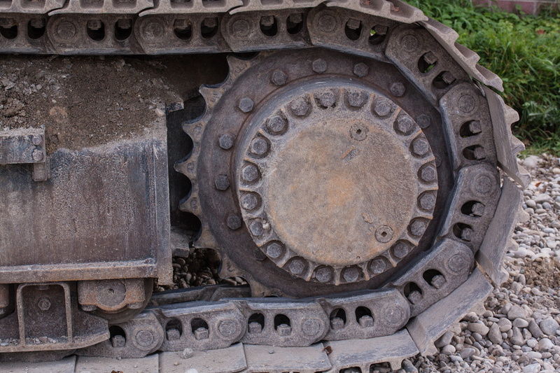 history, shape, nature, carving - craft product, craft, wheel, communication, tracked vehicle, outdoors, geometric shape, old, excavators, high angle view