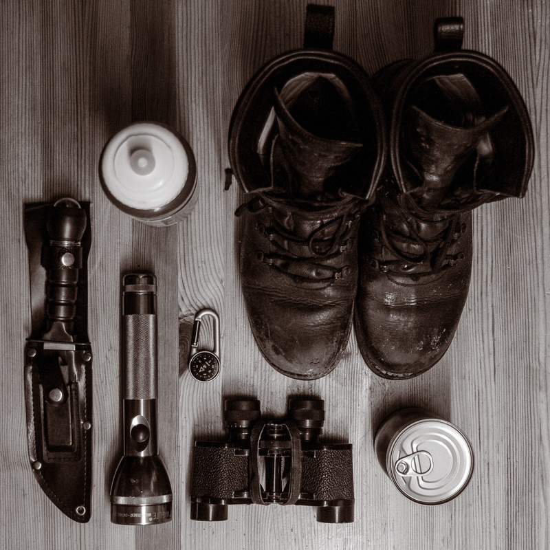 leather, large group of objects, compass, fashion, binoculars, choice, flashlight, directly above, indoors, package, shoe, survive, boots, knife, high angle view