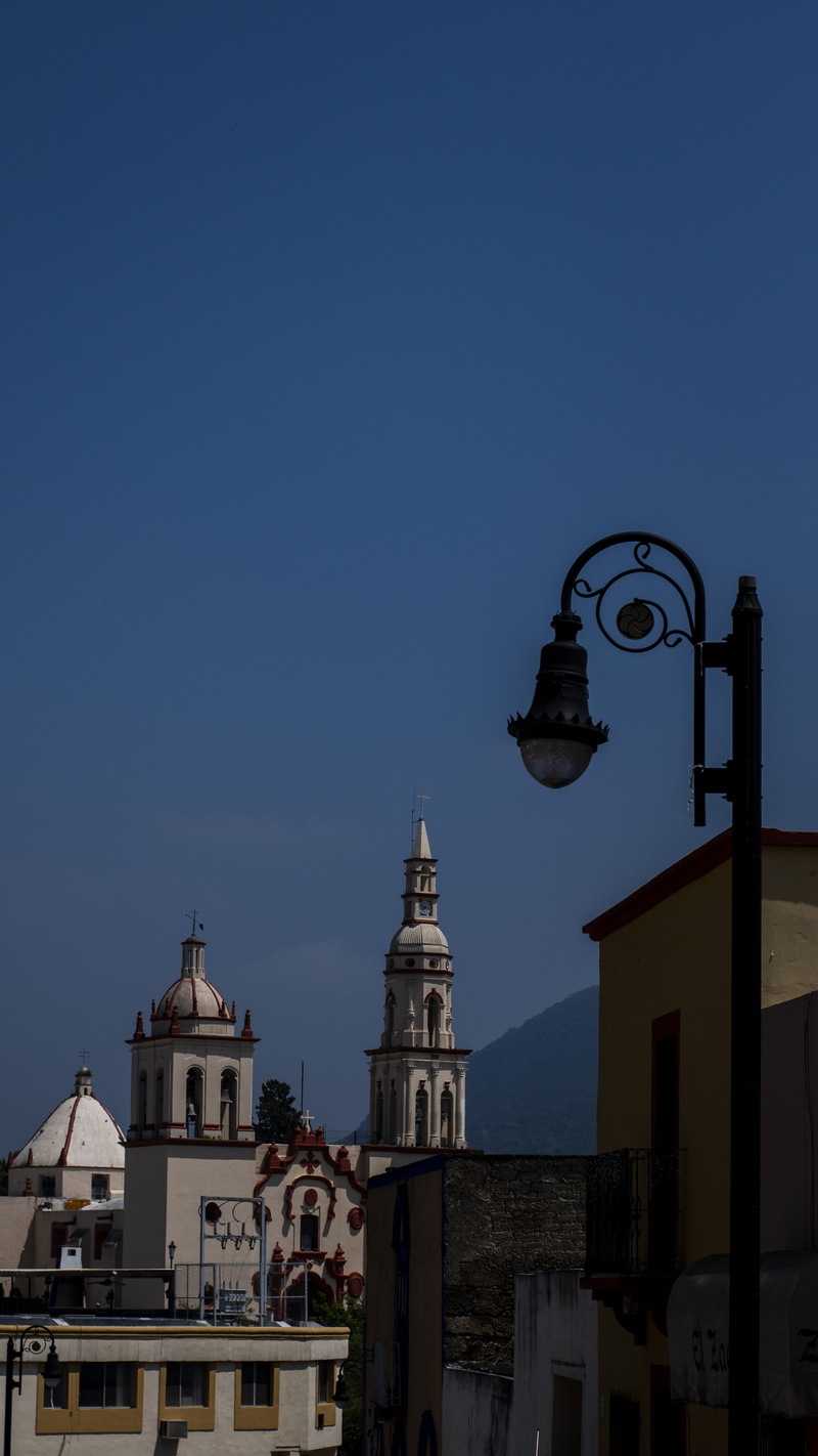 sky, building exterior, colorful, outdoors, residential district, small town, lighting equipment, downtown, low angle view, spire, nature, street light