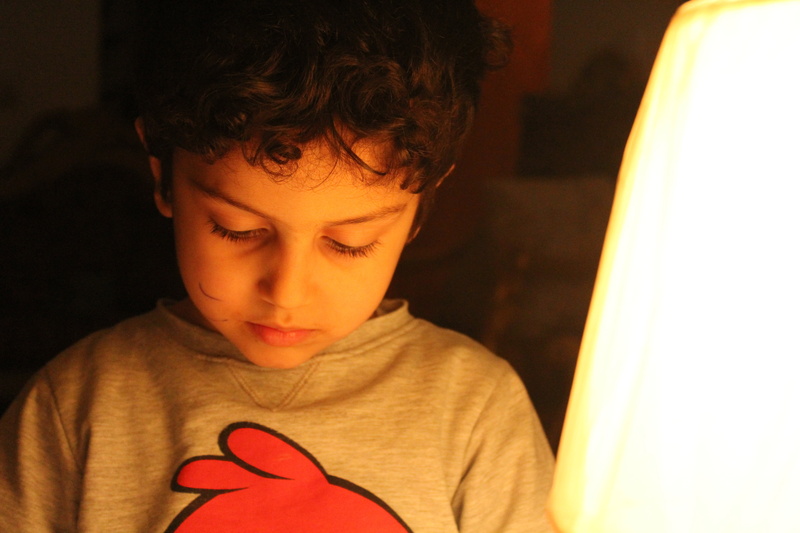 childhood, front view, baghdad, holding, focus on foreground, portrait, drawing, one person, offspring, child, men, boys, headshot, close-up, indoors, emotion