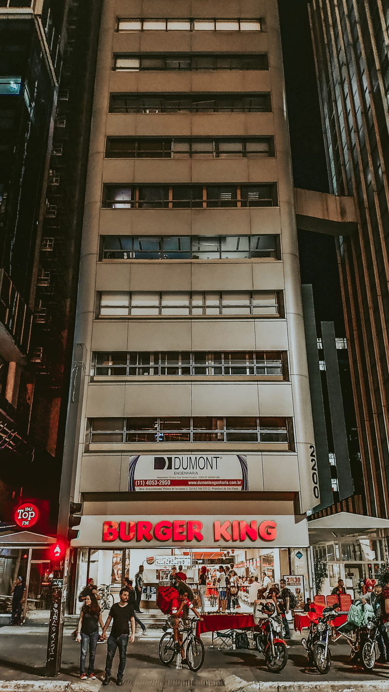western script, land vehicle, apartment building, building exterior, men, women, mode of transportation, architecture, av. paulista, bicycle, bela vista