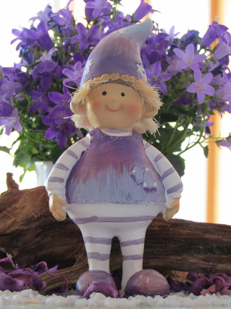 female likeness, joy, human representation, table decoration, garden gnome, male likeness, softness, flowering plant, representation, upper body, imp, flower