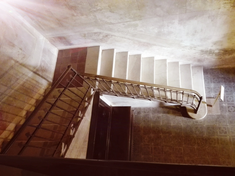 low angle view, indoors, padernello, steps and staircases, architecture, absence, building, castle, directly below, home interior, window, wall - building feature