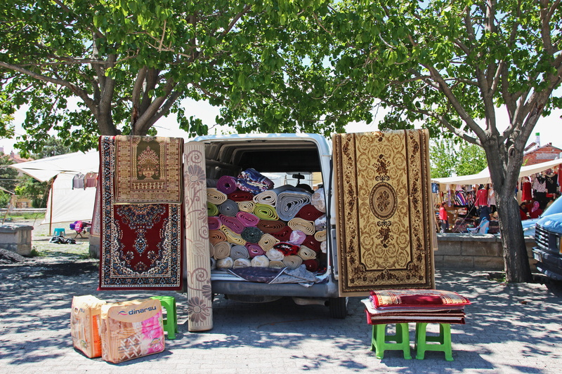 5K, loading, carpet dealers, nature, outdoors, large group of objects, selection, carpets, architecture, tree, no people, floral pattern, retail, day