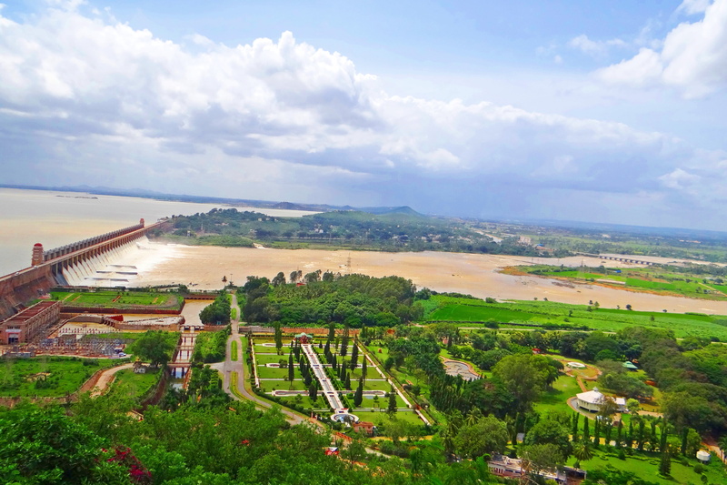 high angle view, scenics - nature, river, day, nature, tungabhadra dam, building exterior, beauty in nature, green color, outdoors, water, city, cloud - sky