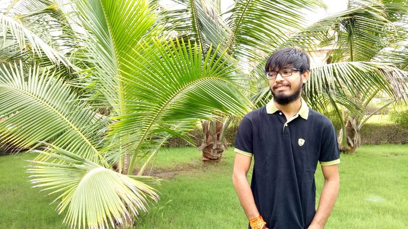 4K, waist up, contemplation, india, green color, front view, standing, young men, gujarat, nature, tree, day, young adult, portrait, tropical climate