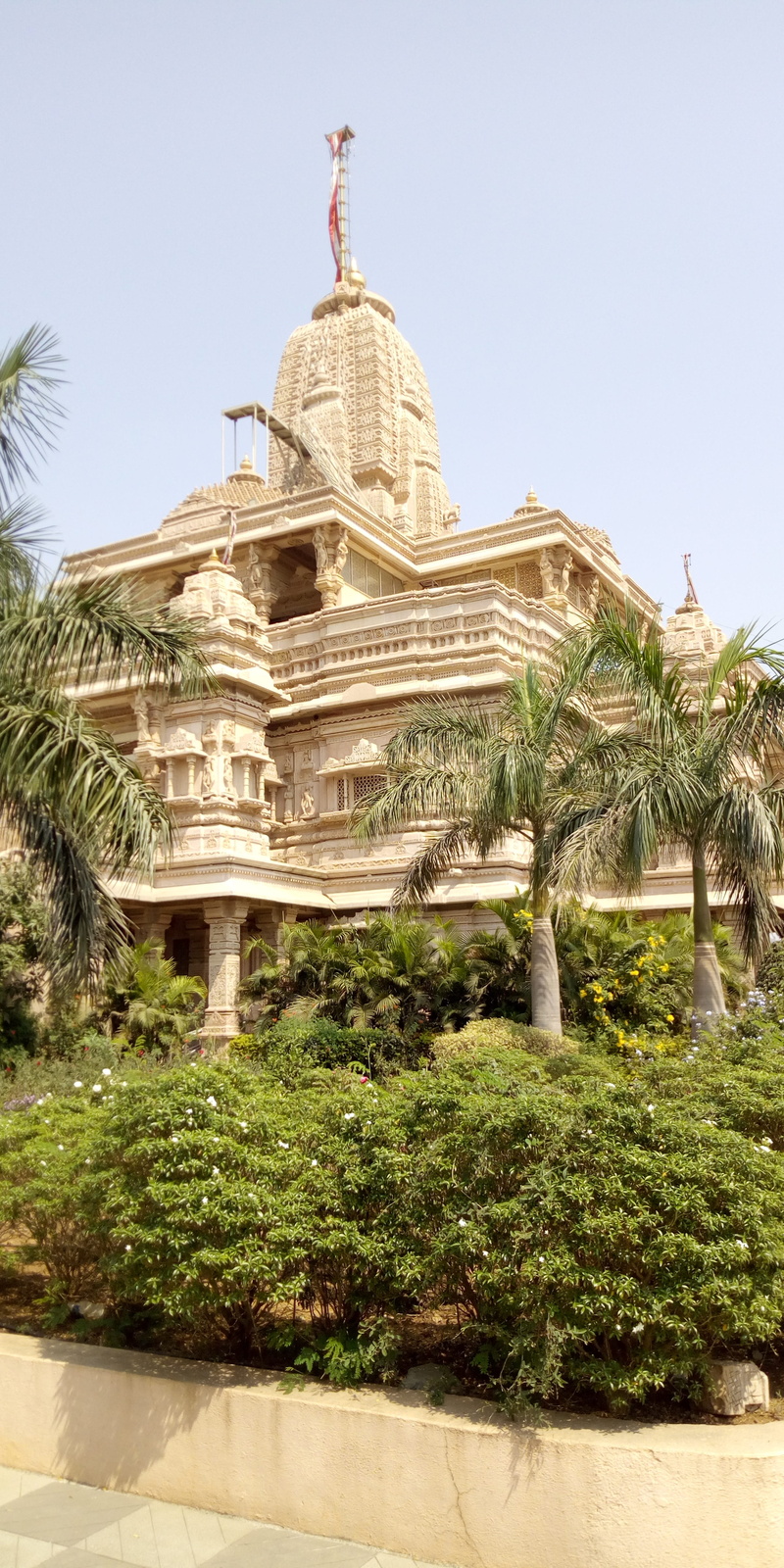 tree, outdoors, sky, plant, nature, belief, growth, building exterior, no people, green color, tropical climate, the past, palm tree, architecture, building