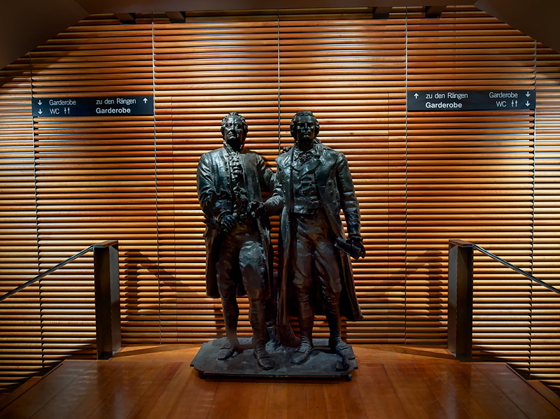 indoors, statue, creativity, building, built structure, artwork, female likeness, security, art, monument, government, museum, text, schiller, theatre square