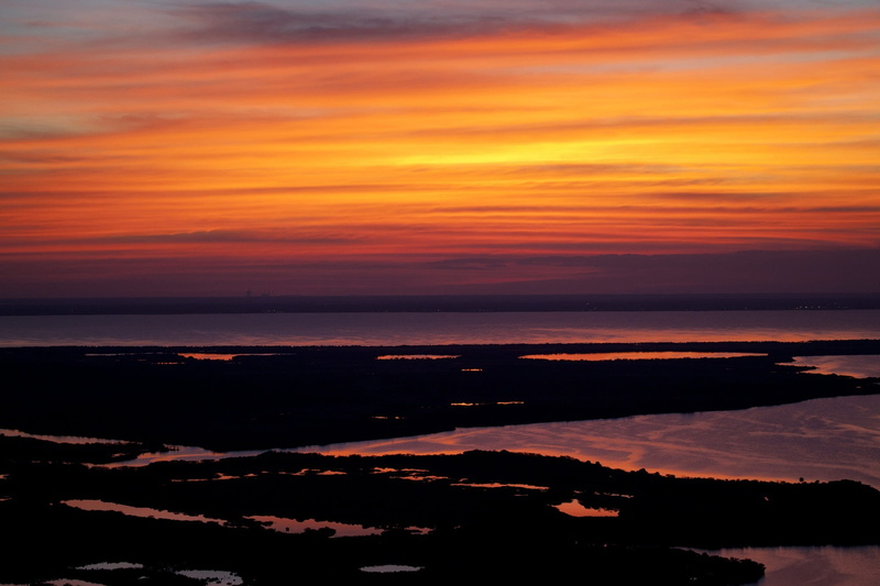 florida, dark, sun, kennedy space center, reflection, no people, beauty in nature, ocean, outdoors, scenic, horizon over water, view, usa, horizon, cloud - sky