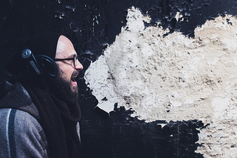 side view, male, outdoors, mature men, aggression, standing, mid adult men, stree, beard, real people, artist, gray, headphones, adult, leisure activity