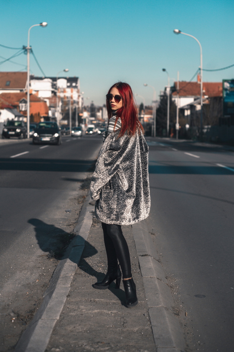 girl, real people, architecture, young adult, one person, lifestyles, full length, beautiful woman, portrait, leisure activity, sweater, redhead, walking