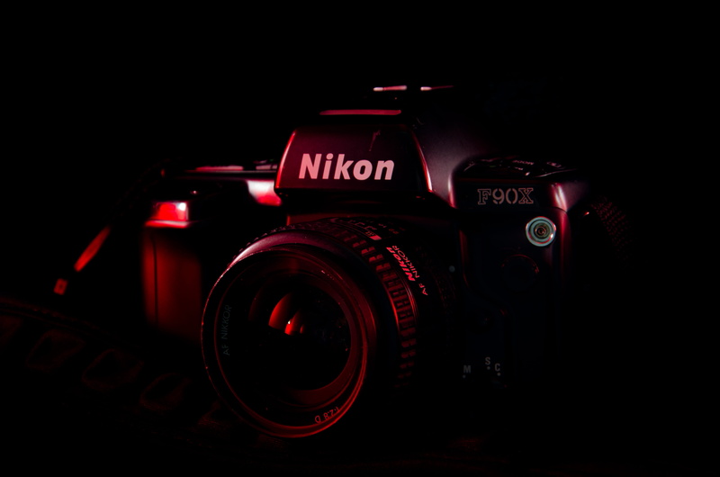 lens - eye, nikon, nikon film camera, black, video camera, photography themes, logo, 4K, dark, close, text, lens - optical instrument, lens cap, camera