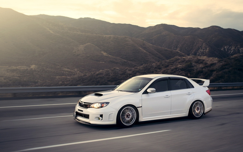 car, city, travel, land vehicle, motion, sky, on the move, day, Subaru, Subaru WRX STI, no people, built structure, motor vehicle, formation, transportation