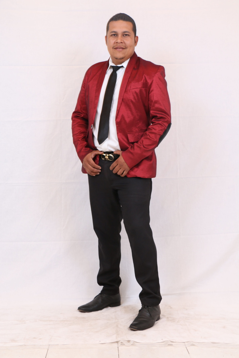 wall - building feature, well-dressed, business, one person, red, flooring, necktie, looking at camera, one man only, hands in pockets, standing, real people