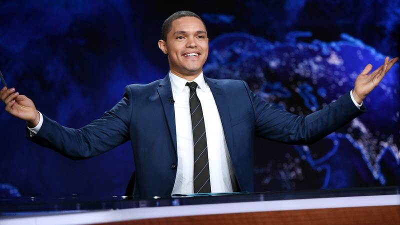 human body part, smiling, adult, businessman, TV Show, The Daily Show With Trevor Noah, human arm, corporate business, positive emotion, suit, body part