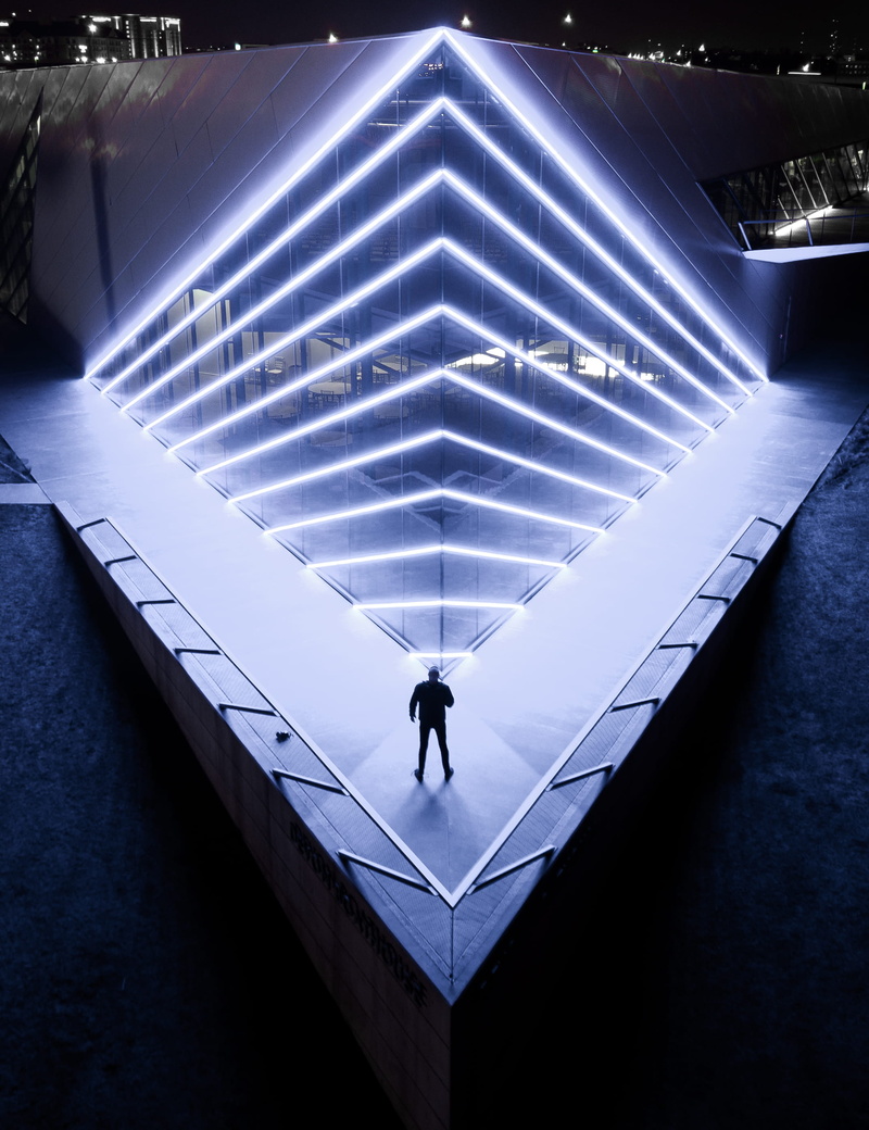 one person, silhouette, exterior, lifestyles, symmetry, design, pattern, stage, built structure, outdoor, man, staircase, real people, ceiling, building