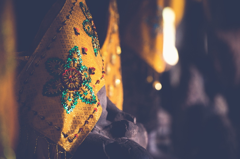 fabrix, traditional clothing, yellow, focus on foreground, color, temple, real people, cambodia, multi colored, pattern, human body part, texture, statue