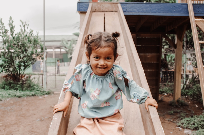 innocence, playground, travel, leisure activity, children, one person, krong siem reap, front view, smiling, girls, outdoors, three quarter length, casual clothing