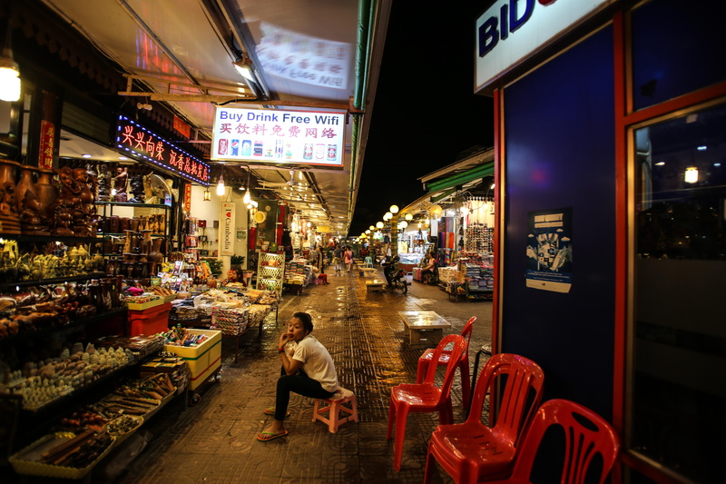 siem reap, store, men, illuminated, women, city life, night, market, choice, krong siem reap, 5K, built structure, real people, text, cambodia, one person