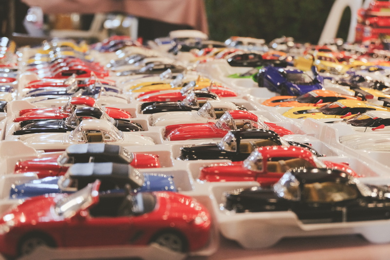 in a row, parking lot, car show, store, assorted, consumerism, arrangement, miniature, car, choice, kart, multi colored, human, motor vehicle, selective focus