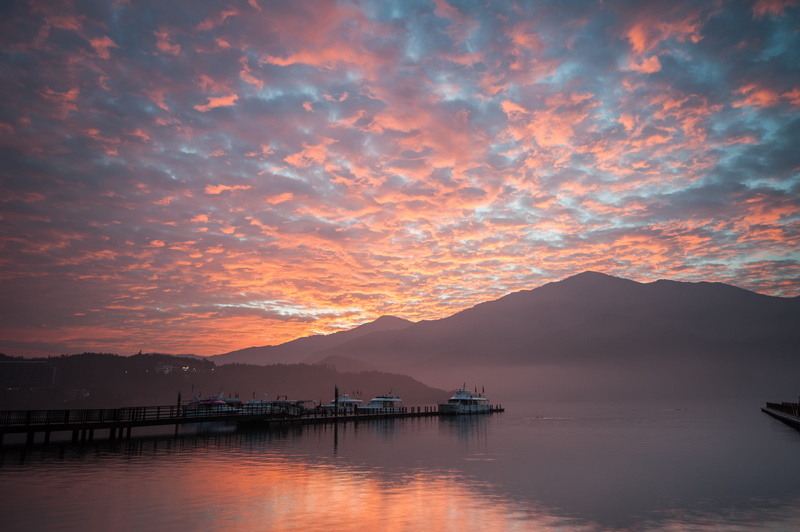 mountain, tranquility, orange color, taiwan, mountain range, beauty in nature, bay, sky, cloud - sky, water, sea, transportation, waterfront, nature, sunset