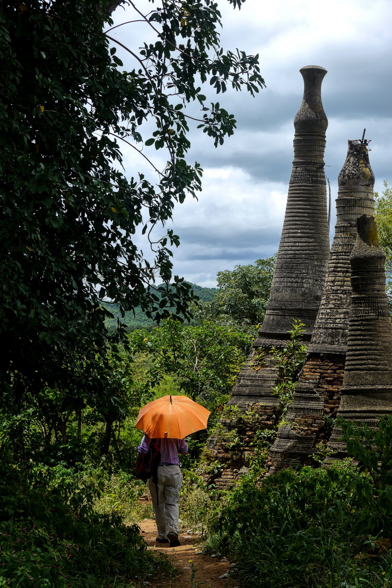 architecture, landscape, monastery, heritage, religion, old, sky, temple, buddhist, real people, stupa, landmark, rear view, tourism, cloud - sky, lifestyles