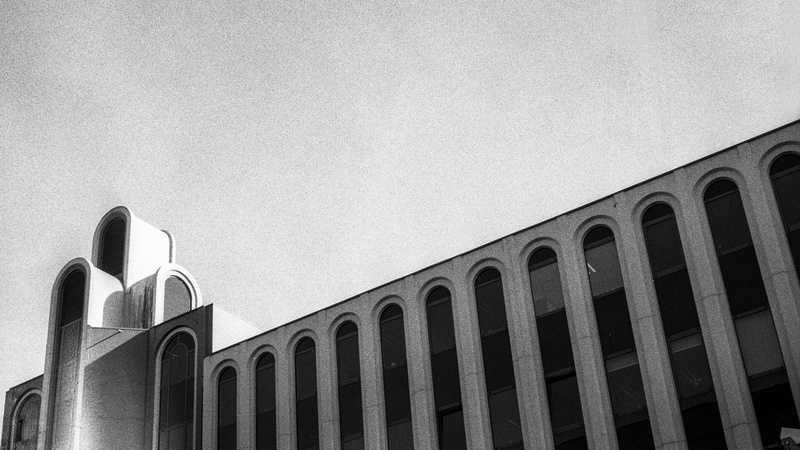 pattern, side by side, clear sky, monochrome, architectural feature, gent, sky, building, 2K, electro, yashica, building exterior, analog, ilford, outdoors