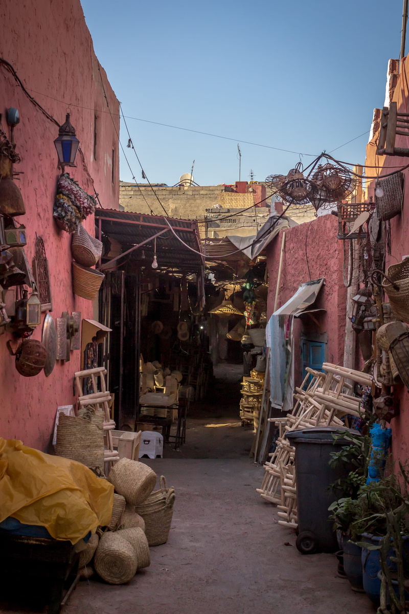 day, hanging, textile, nature, built structure, direction, market, building, marrakesh, street, city, sky, road, no people, house, residential district