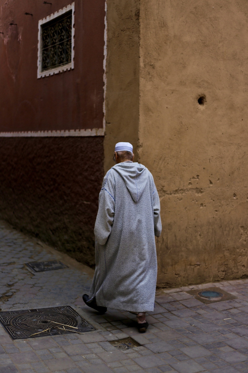 building exterior, full length, lifestyles, religion, 2K, belief, wall, wall - building feature, travel, footpath, morocco, old man, adult, marrakesh