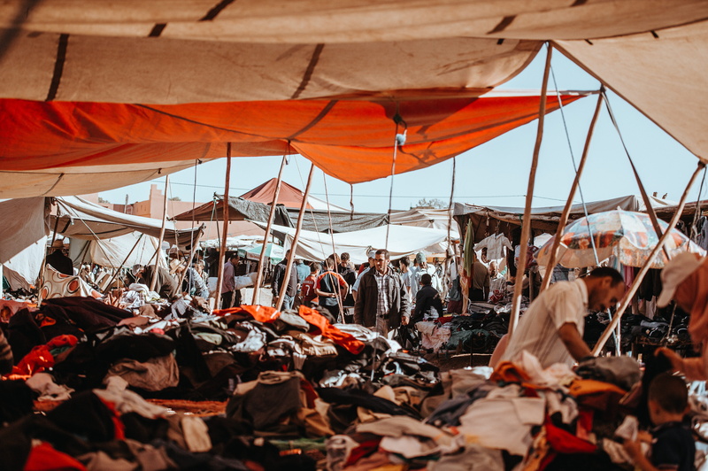 vendor, women, travel, sailboat, berber, crowd, clothes, outdoors, morocco, market stall, canopy, lot, large group of people, group of people, tourism