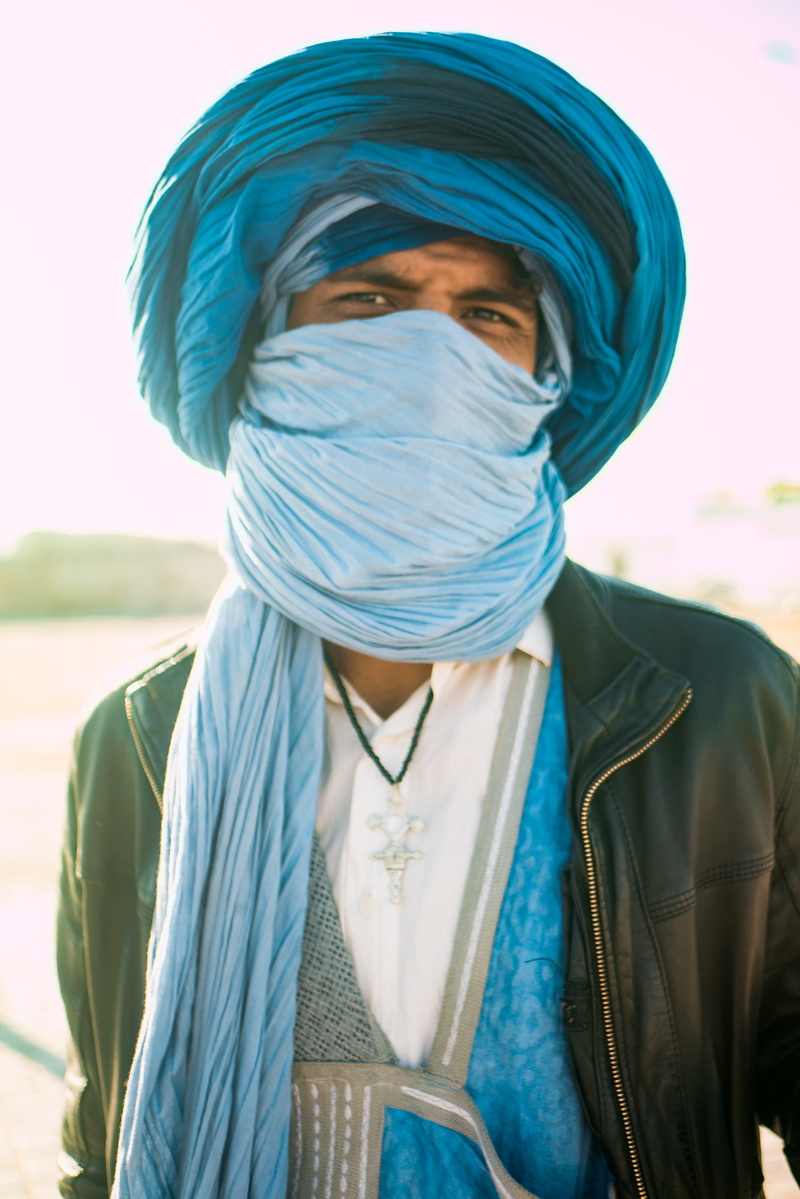 nature, real people, tribe, adult, teal, lifestyles, market, jacket, blue, leisure activity, portrait, young adult, berber, mysterious, focus on foreground