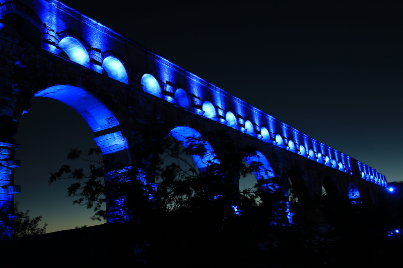 black, bridge - man made structure, building exterior, france, concrete, architectural column, travel destinations, night, plant, bridge, low angle view