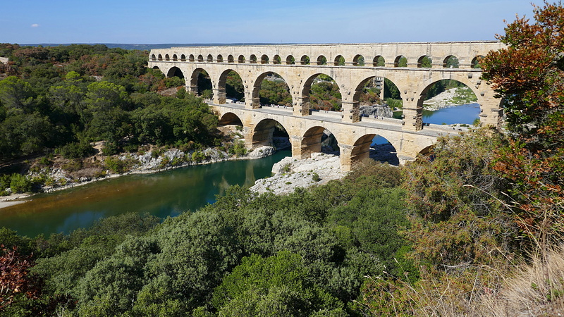 arch bridge, surrounded, roman, 5K, built structure, france, day, reflection, pont du gard, gray, water, history, bridge, outdoors, transportation, connection
