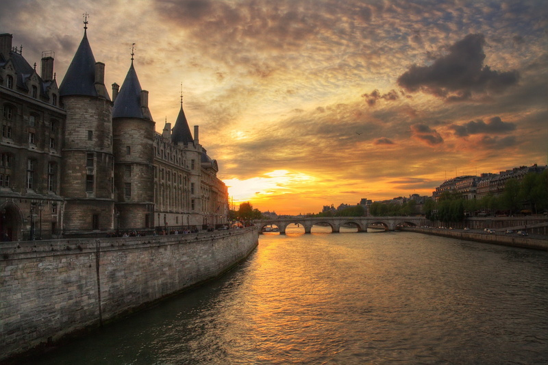 river, building exterior, no people, built structure, architecture, waterfront, cloud - sky, connection, travel destinations, orange color, city, sky, old building