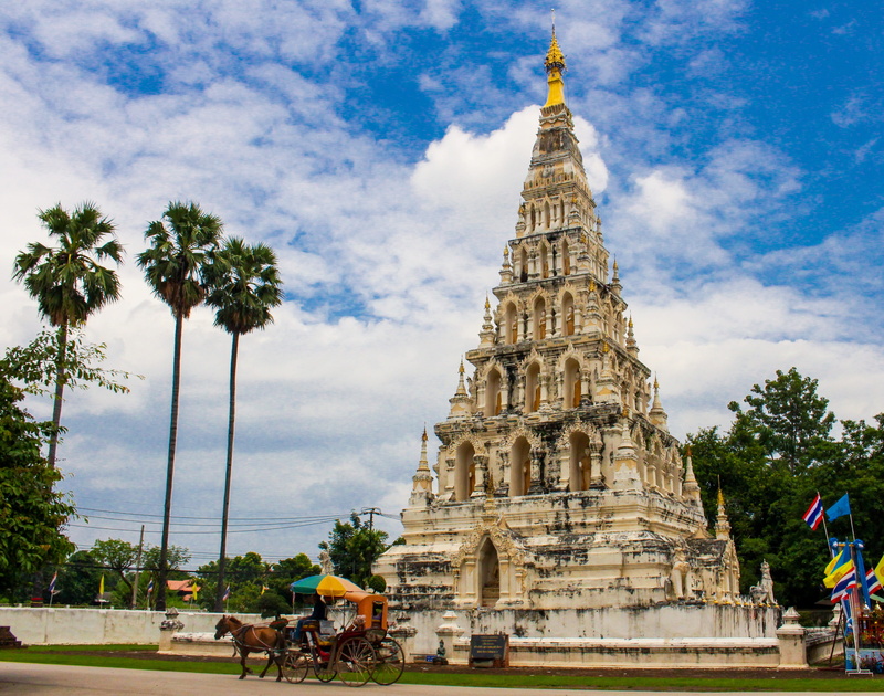 building, palm tree, travel destinations, history, belief, sky, wat chedi liam, religion, building exterior, outdoors, the past, built structure, day, Pagoda