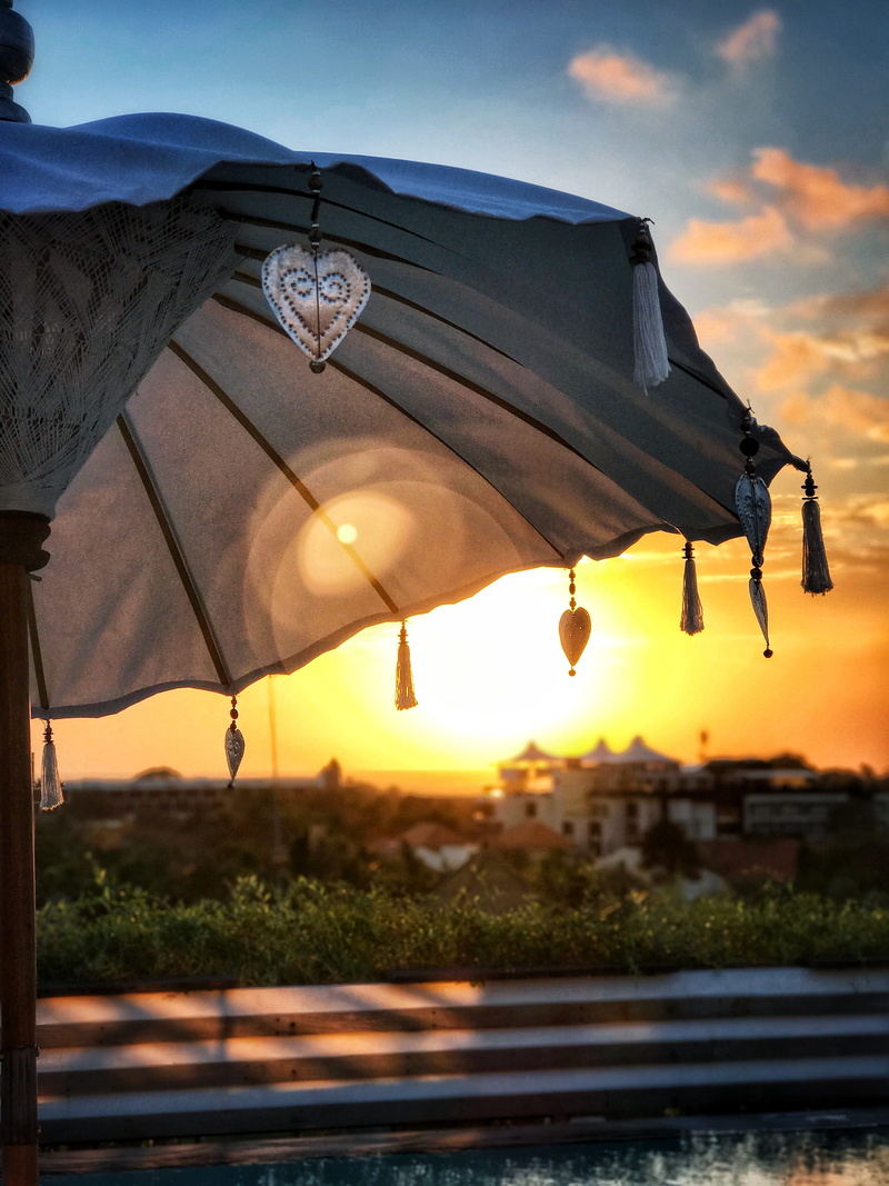 sky, textile, love, architecture, sundown, sunlight, focus on foreground, outdoors, amazing, water, seminyak beach, cloud - sky, orange color, sunset, bali