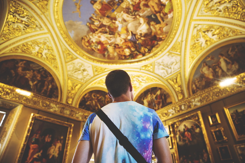 adult, museum, italian, paintngs, gold, tiedye, wearing, standing, arch, waist up, blue, religion, building, place of worship, belief, painting, assorted