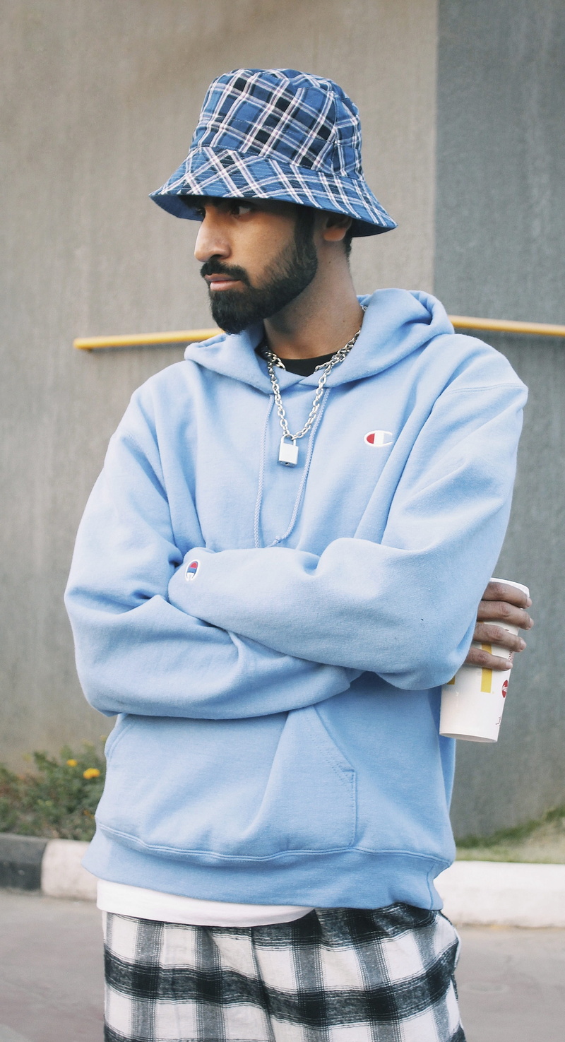 fashion, arms, apparel, cap, three quarter length, india, looking, blogger, hyderabad, real people, sweater, facial hair, architecture, beard, contemplation