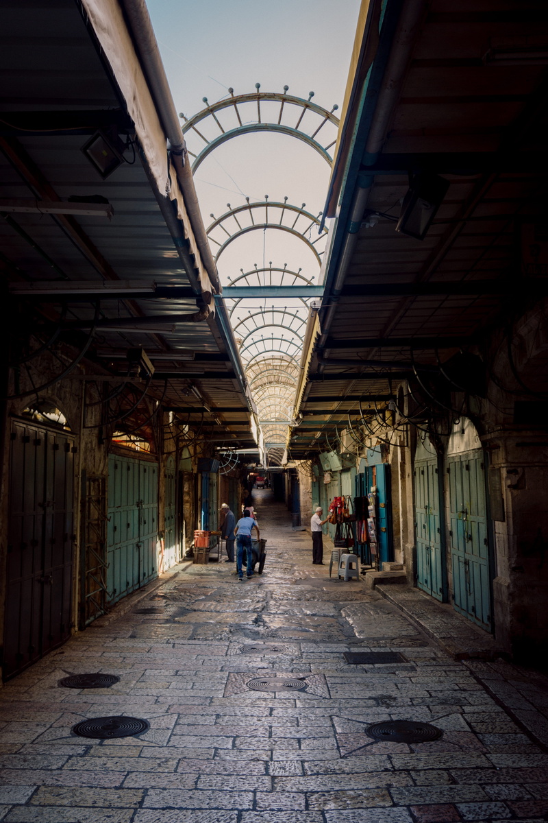 shops, the way forward, diminishing perspective, stone, ceiling, alley, men, lifestyles, one person, shop, real people, jerusalem, architectural column