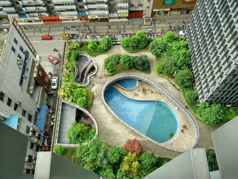 top view, look down, outdoors, high angle view, travel destinations, the scenery, tianfu square, swimming pool, building exterior, growth, transportation