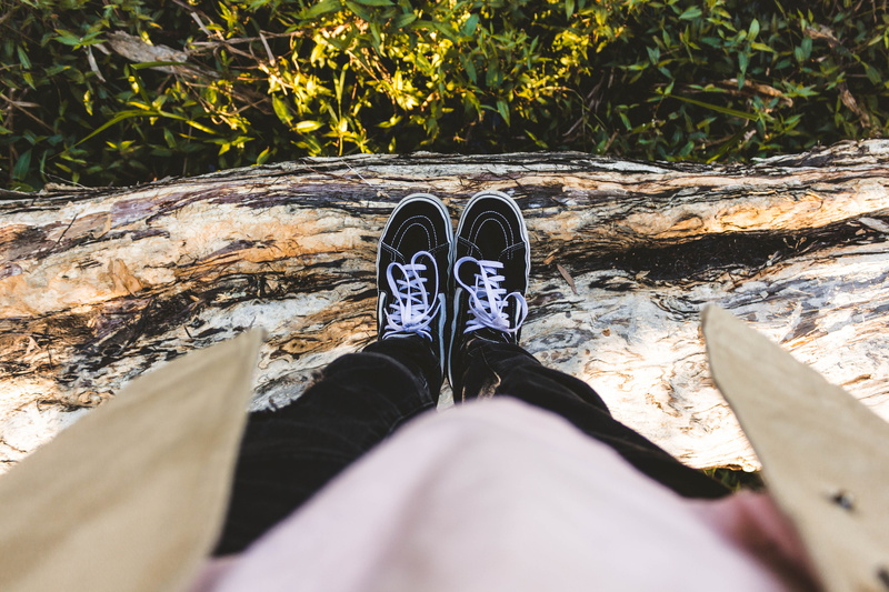 pink shirt, shoe, unrecognizable person, feet, grass, land, bark, black, lifestyles, high angle view, leisure activity, human body part, real people, green