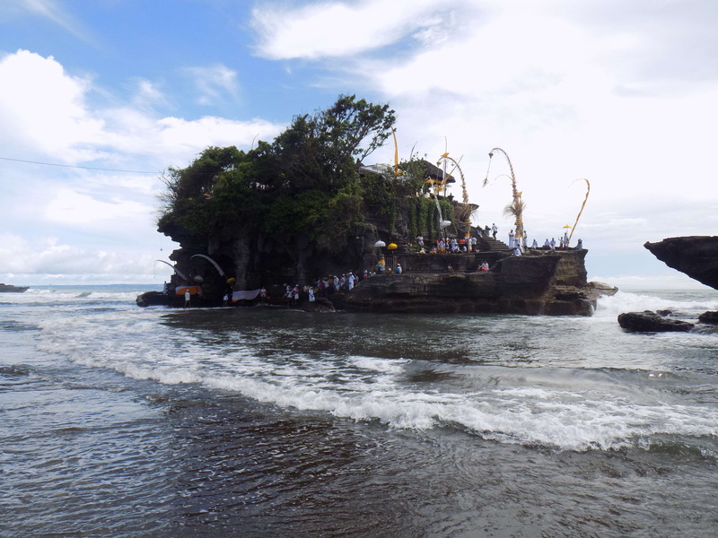 hindu, day, nautical vessel, rock - object, beauty in nature, scenics - nature, sky, island, cultural, wave, land, waterfront, sea, ritual, bali, beach