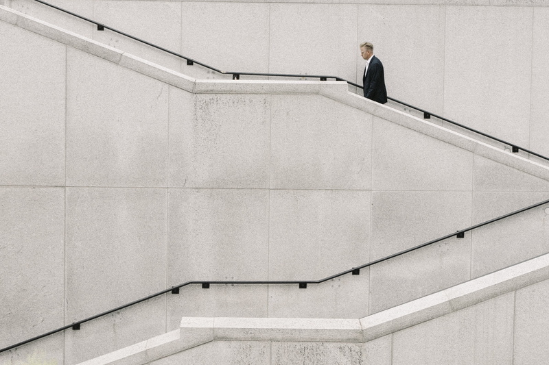 wall, beside, fashion, corporate business, copy space, railing, one person, people, stairs, males, steps and staircases, architecture, man, well-dressed