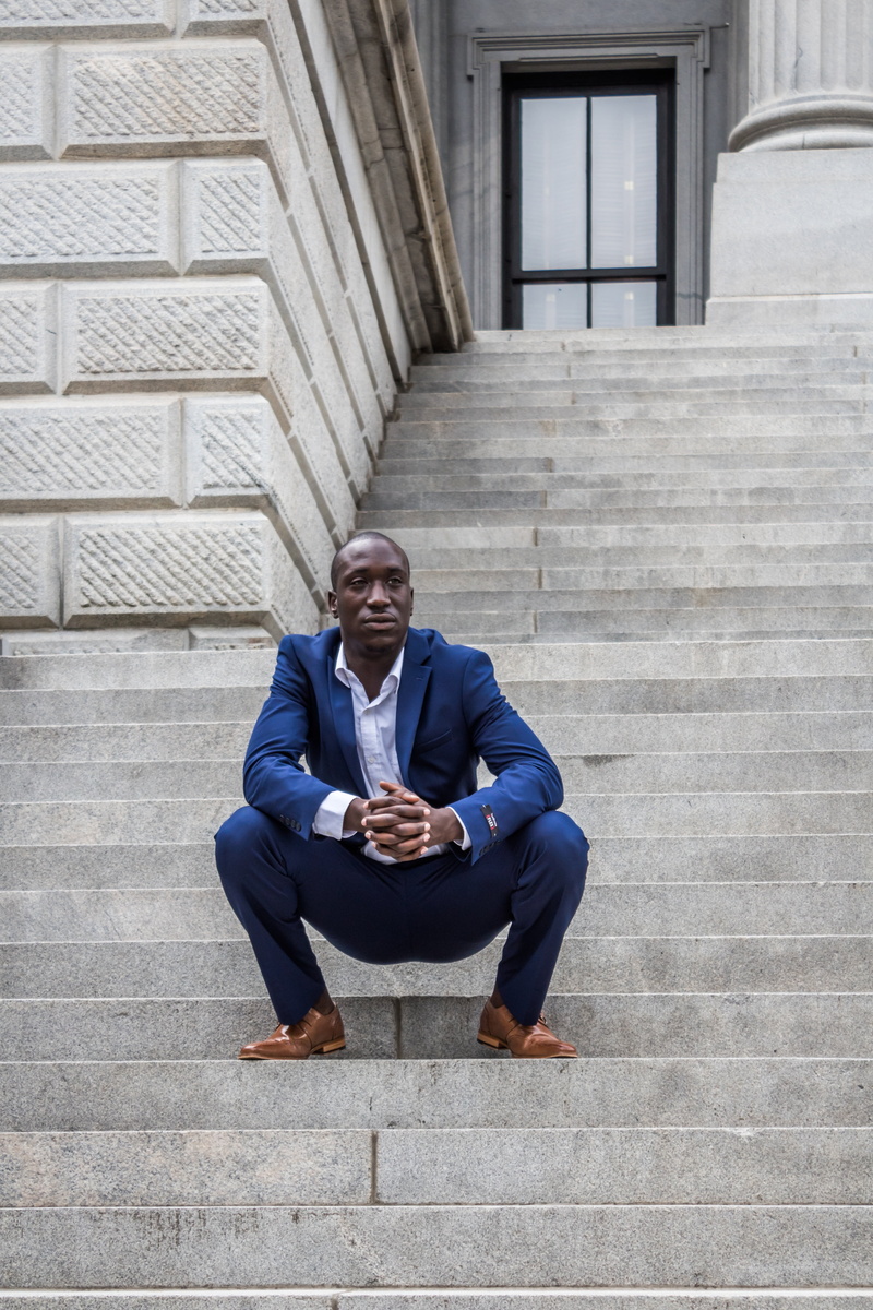 built structure, young, staircase, urban, male, well-dressed, steps and staircases, man, outdoor, blue, people, one person, real people, handsome, pants
