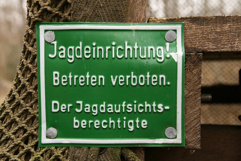 hunting sign, script, information, border, ban, animal, tree trunk, focus on foreground, communication, day, prohibited, guidance, message, animal themes