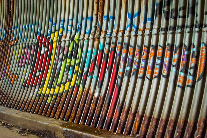 high angle view, graffiti, create, in a row, expression, variation, order, no people, side by side, rust, trespassing, multi colored, full frame, old, vintage