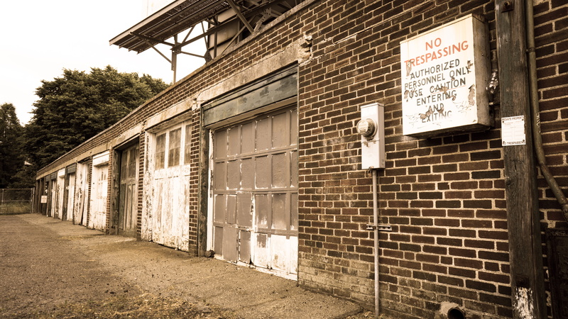 electric meter, text, brick, antique, day, historic, tree, trees, home, communication, window, outdoors, back, garage, city, footpath, warehouse, no trespassing